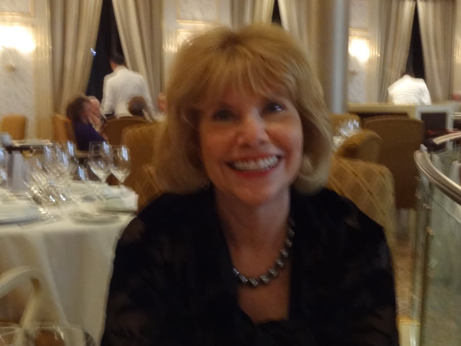 Lynn smiling at dinner